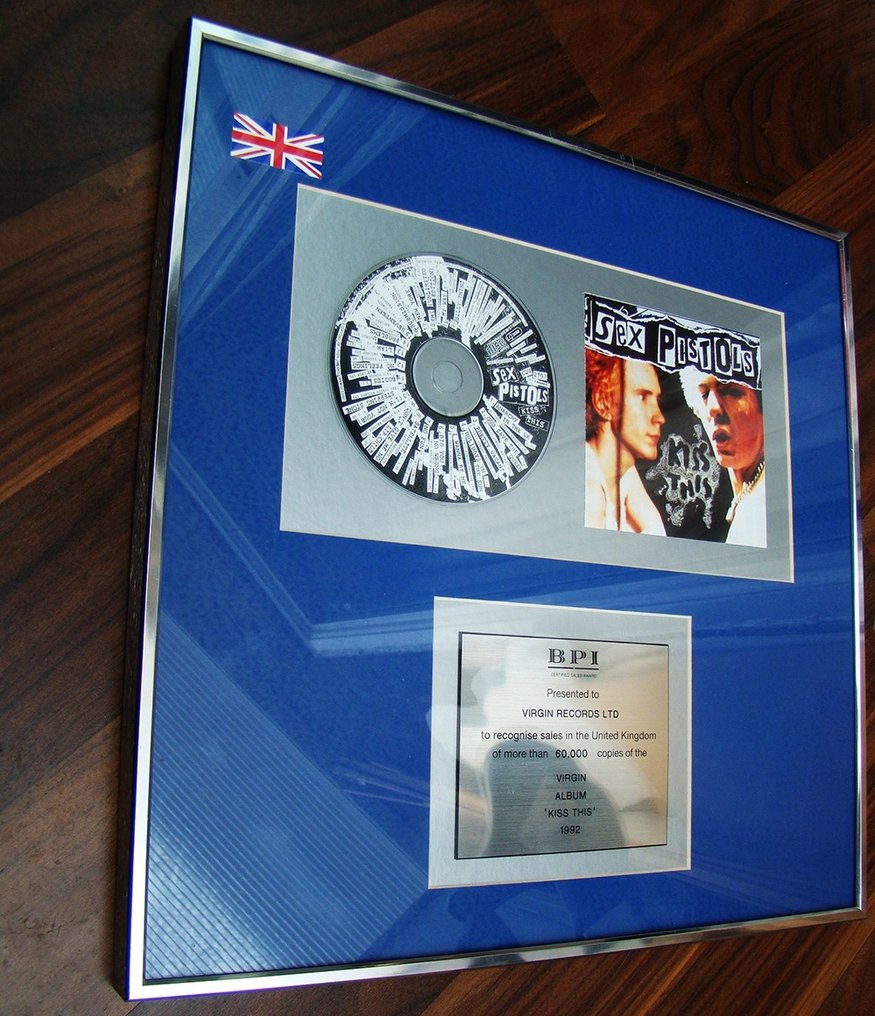 Sex Pistols Kiss This Gold Sales Award Presented To Virgin
