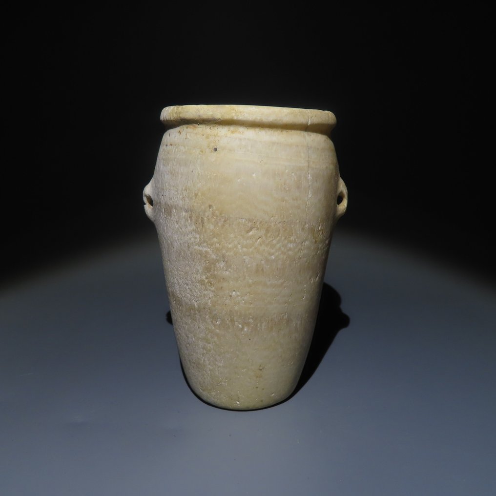 Ókori egyiptomi Alabástrom Két fogantyús üvegedény. Predinasztikus – vékonyrétegű időszak. 9,5 cm H. Spanyol exportengedély. #1.1