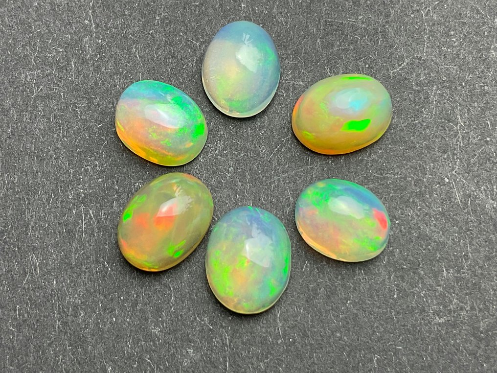 7 pcs white to light orange + play of color crystal opals - 7.47 ct #2.1