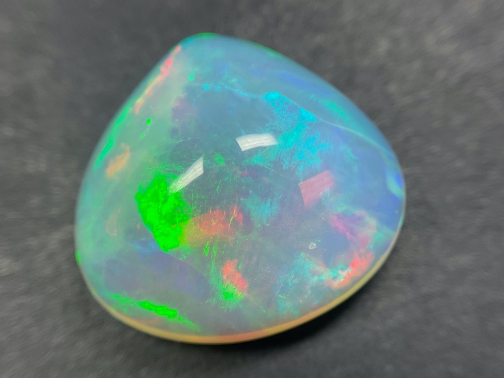 White (orange) + Play of Color (Vivid) Crystal opal - 7.56 ct #2.2