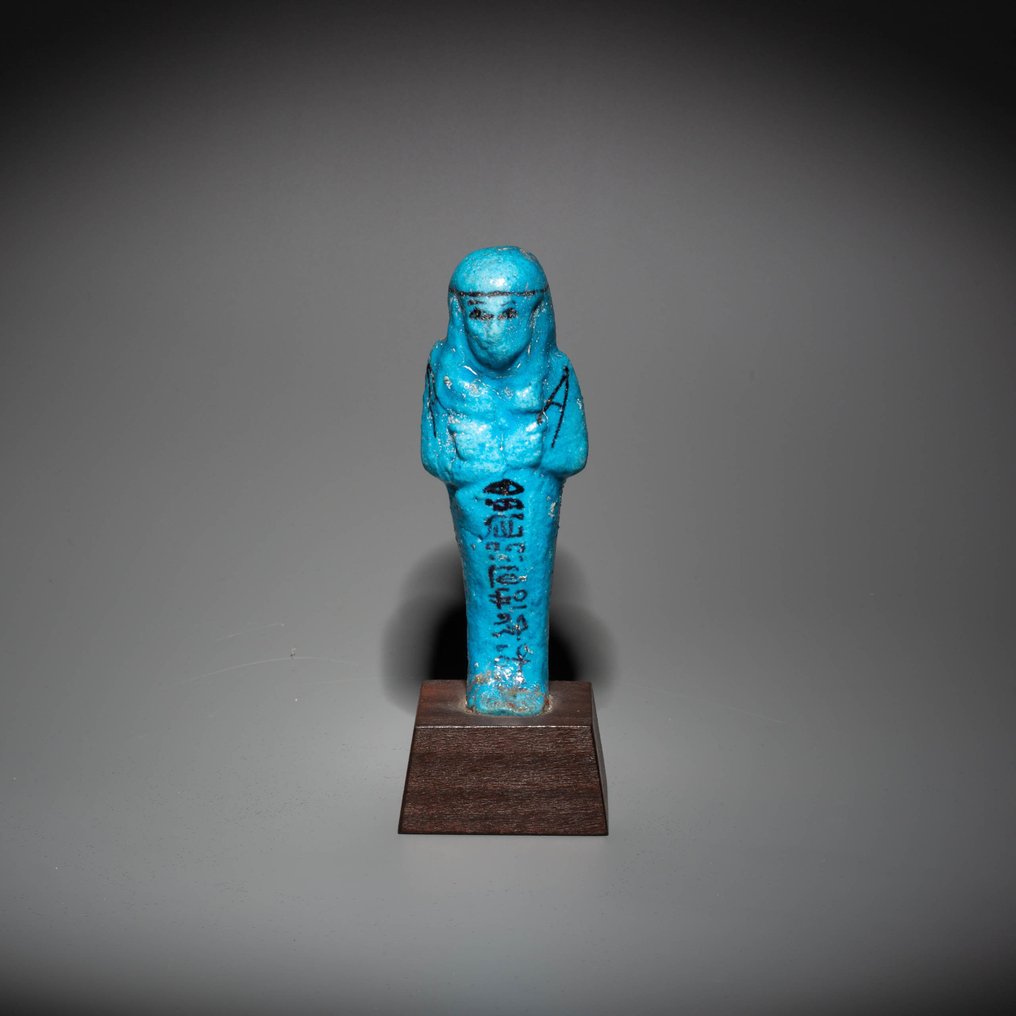 Ancient Egyptian Faience Shabti for the overseer of granaries, Djedkhonsu-iwf-ankh. 10,5 cm H. Intact. Spanish Export License #1.2