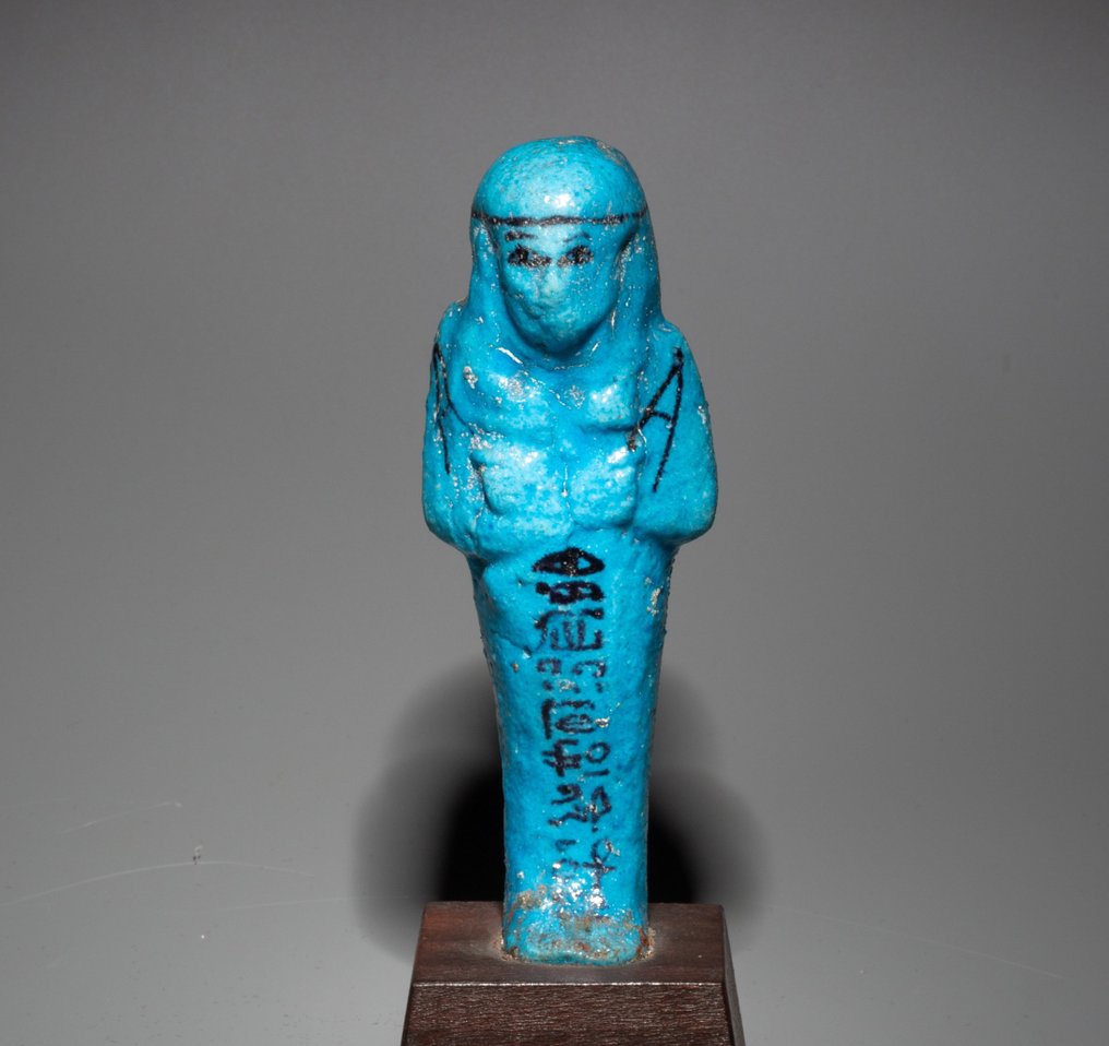 Ancient Egyptian Faience Shabti for the overseer of granaries, Djedkhonsu-iwf-ankh. 10,5 cm H. Intact. Spanish Export License #1.1