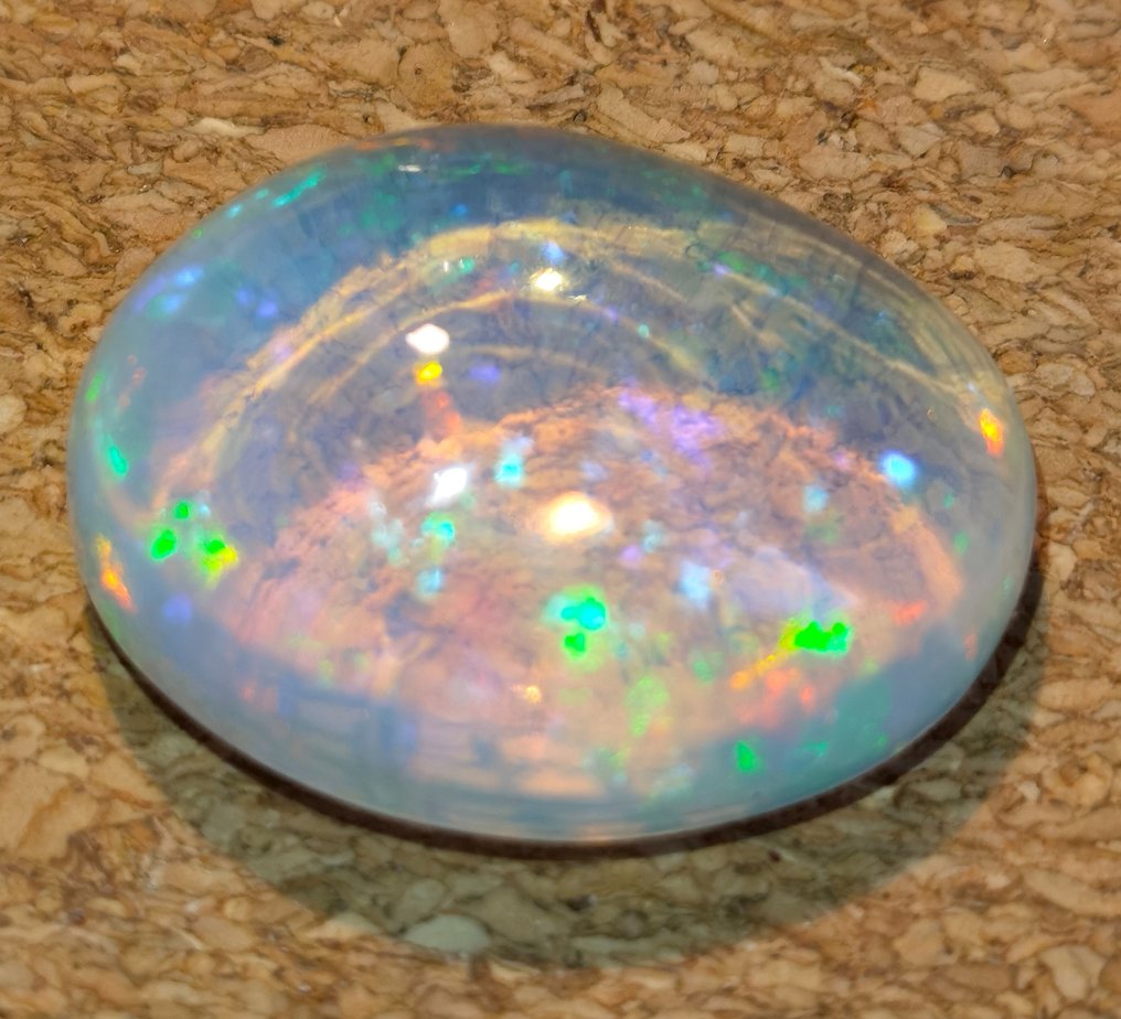 White (Orangy) + Play of Colors (Vivid) Opal - 24.94 ct #1.1