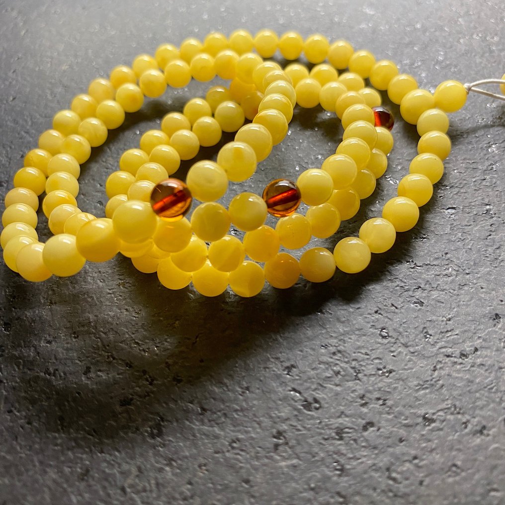 Pressed amber beads top