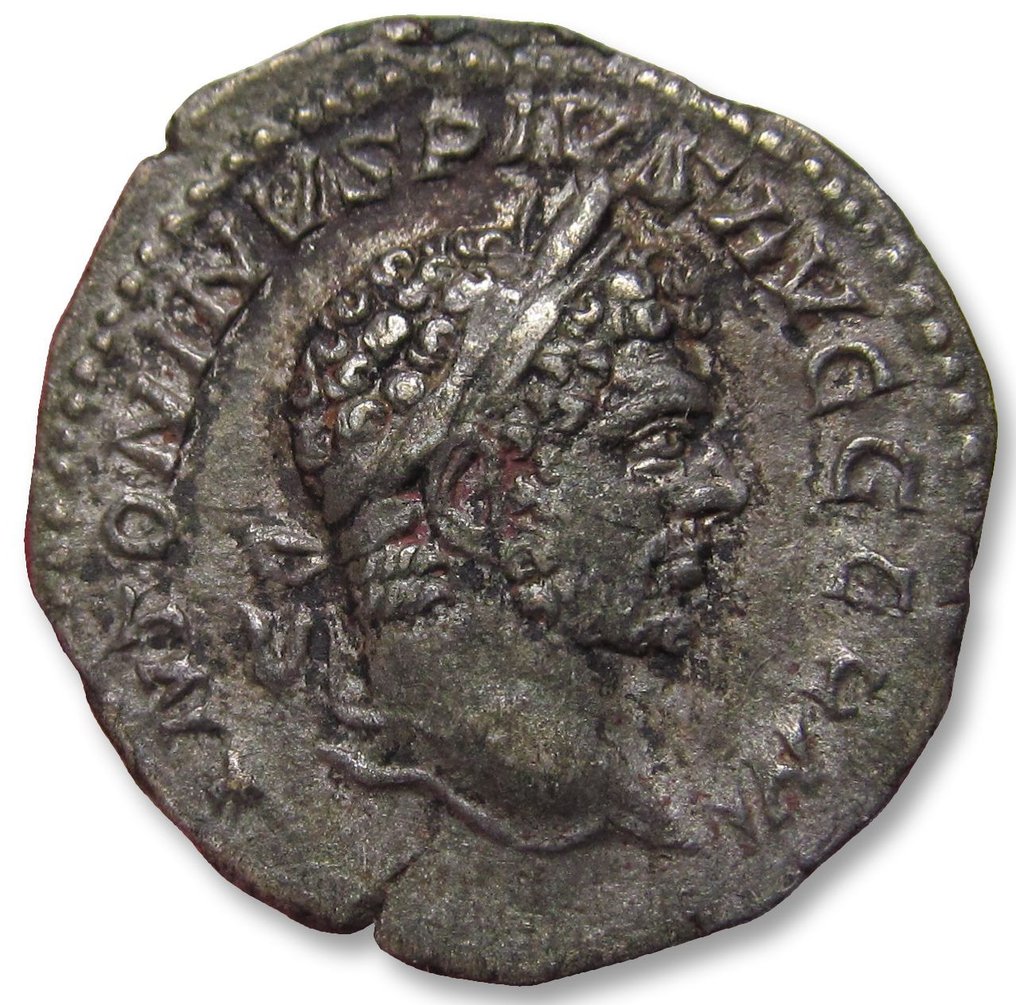Empire romain. Caracalla (198-217 apr. J.-C.). Denarius Rome mint 214 A.D. - Apollo seated left, leaning on lyre set on tripod - #1.2