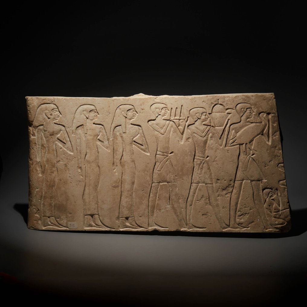 Ancient Egyptian Limestone Mastaba relief offerings to the deceased. Old Kingdom, 2200 - 2050 BC. 36 cm length. French export #1.1