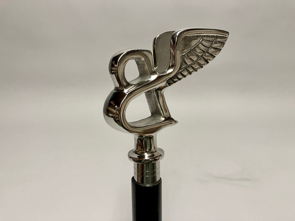 Walking stick - Wood with a Bentley emblem as a handle. #1.0