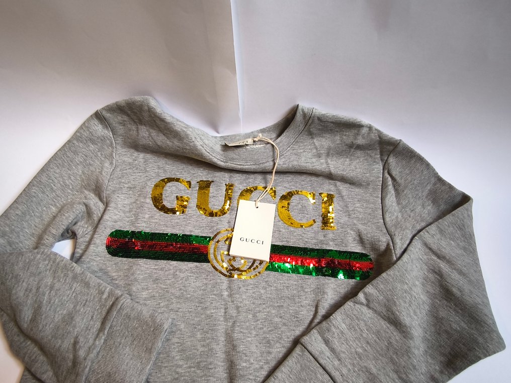 Price of gucci sweatshirt hotsell