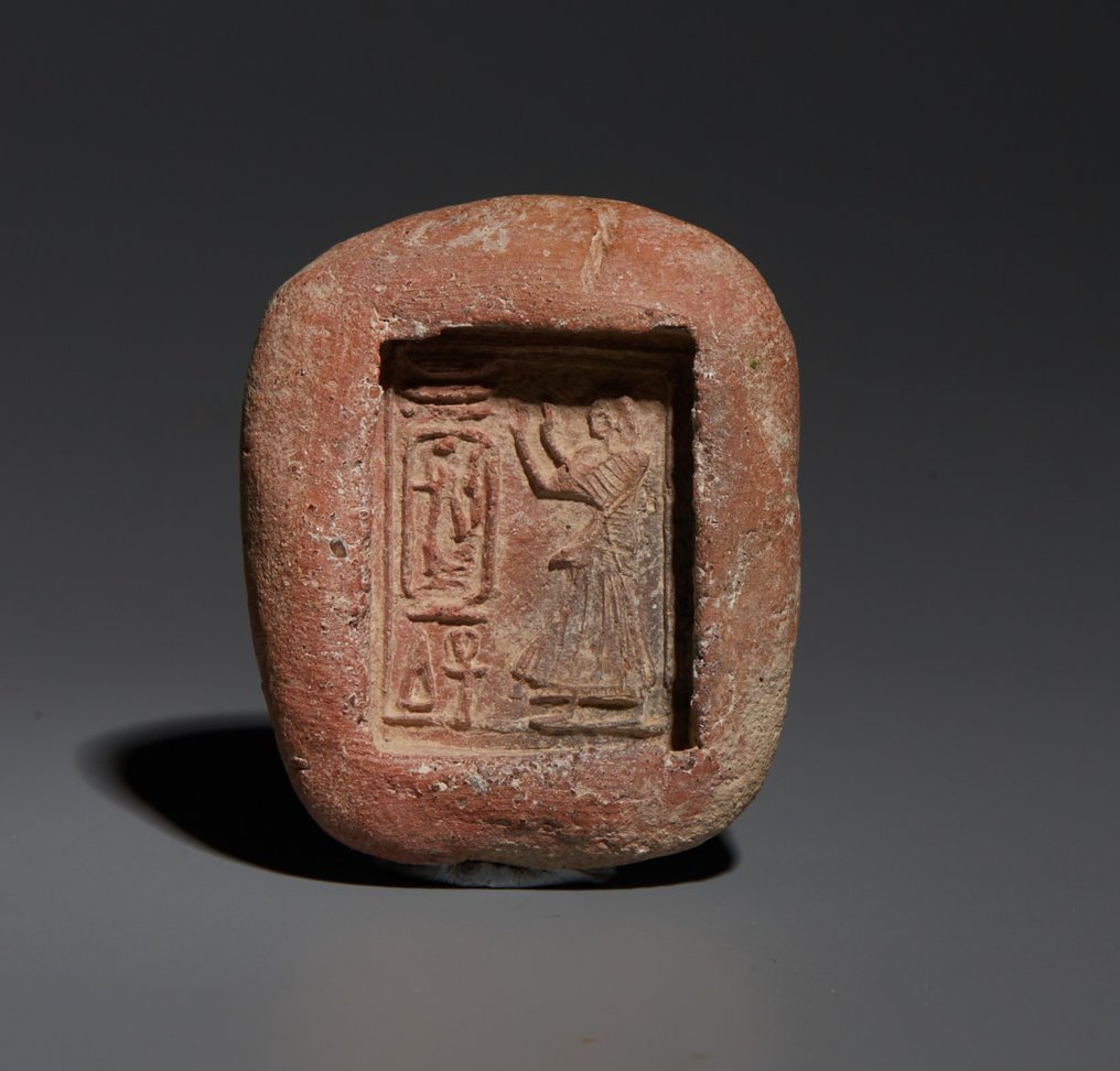 Ancient Egypt, New Kingdom Terracotta Mold of an offerer in front the cartouche of Ramses II. c. 1279 - 1243 BC. 3,6 cm H. Spanish Export #1.2