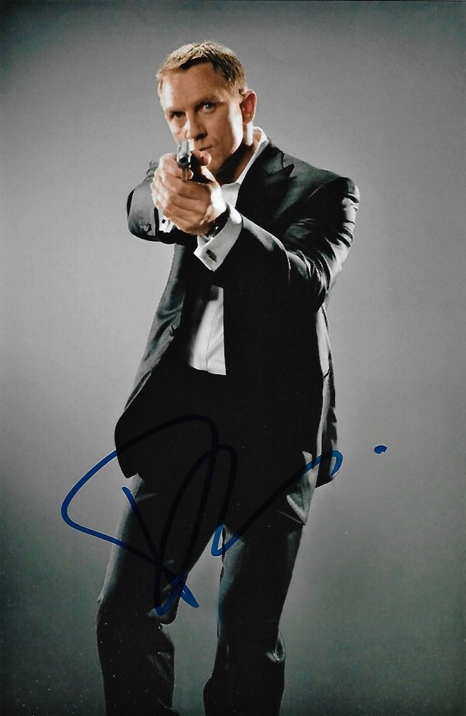 James Bond 007: Skyfall - Daniel Craig Autographed Photo in classic Bond pose with gun b'bc COA. #1.1