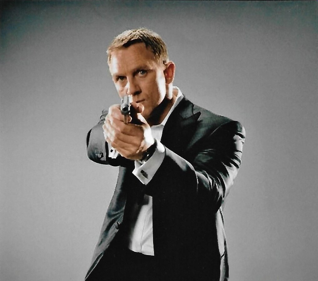 James Bond 007: Skyfall - Daniel Craig Autographed Photo in classic Bond pose with gun b'bc COA. #2.1