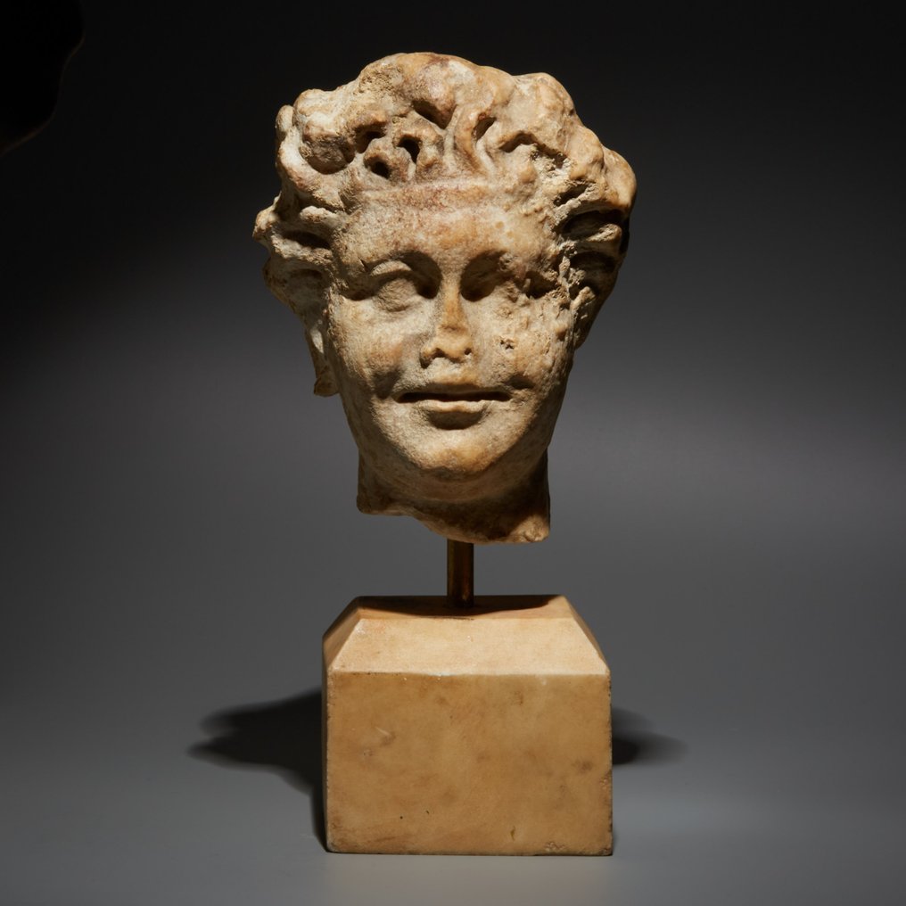 Romerska antiken Marmor Fint huvud av en satyr eller faun. 1:a - 2:a århundradet e.Kr. 28 cm H. Spansk exportlicens #1.1