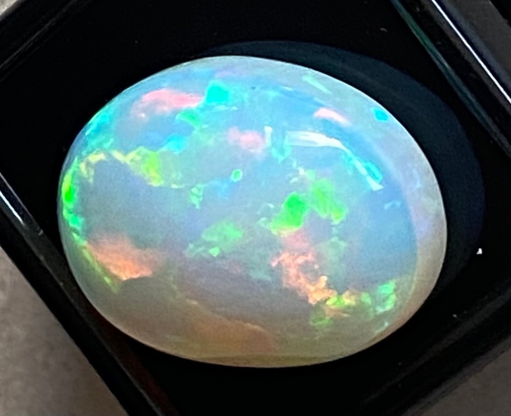 1 pcs  Orange Opal  - 12.19 ct - International Gemological Institute (IGI) - Play of color #1.0