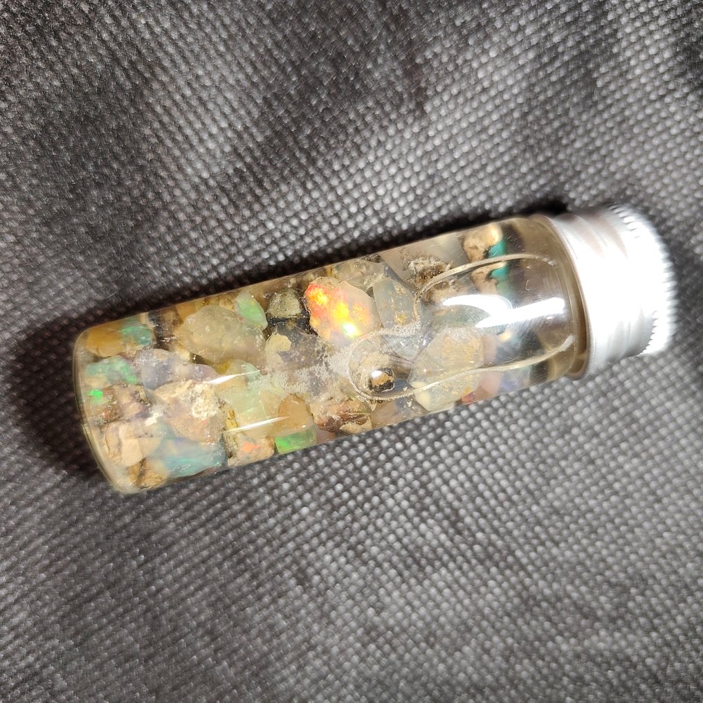 70 carats of Welo opal rough and pre-polished stones. Rough- 14 g - (1) #1.0