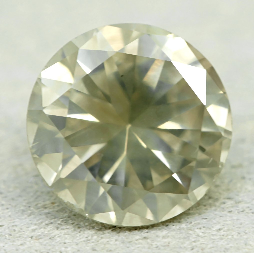 1 pcs Diamant (Naturfarvet) - 1.07 ct - Rund - Faint Gullig Grå - I1 - Gem Report Antwerp (GRA) #4.3