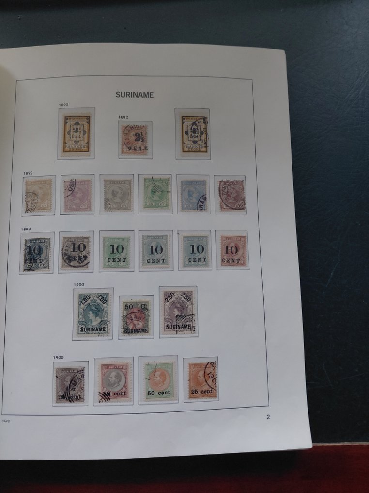Suriname 1873/1949 - Well-filled collection in Davo crystal album. - Goegevulde, vrij complete Collectie Suriname #2.1