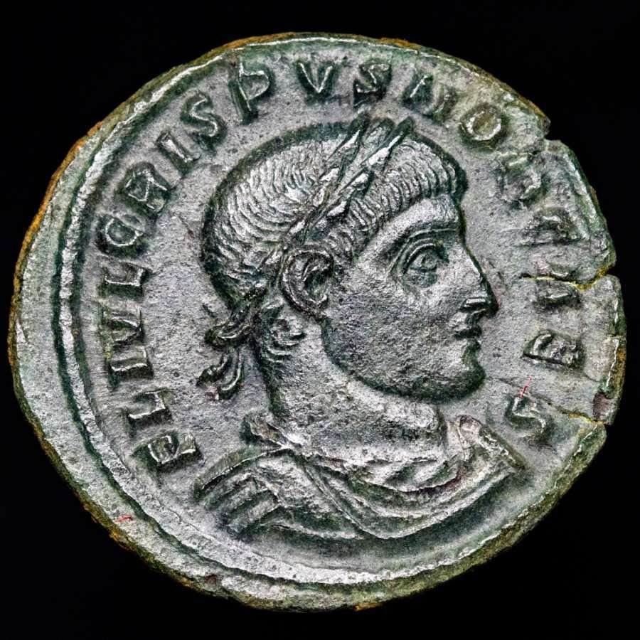 Roman Empire. Crispus (AD 317-326). Follis Arles mint, 316-326 A.D.. CAESARVM NOSTRORVM VOT / X in two lines within decorated wreath; S☆AR. (No reserve price) #1.0