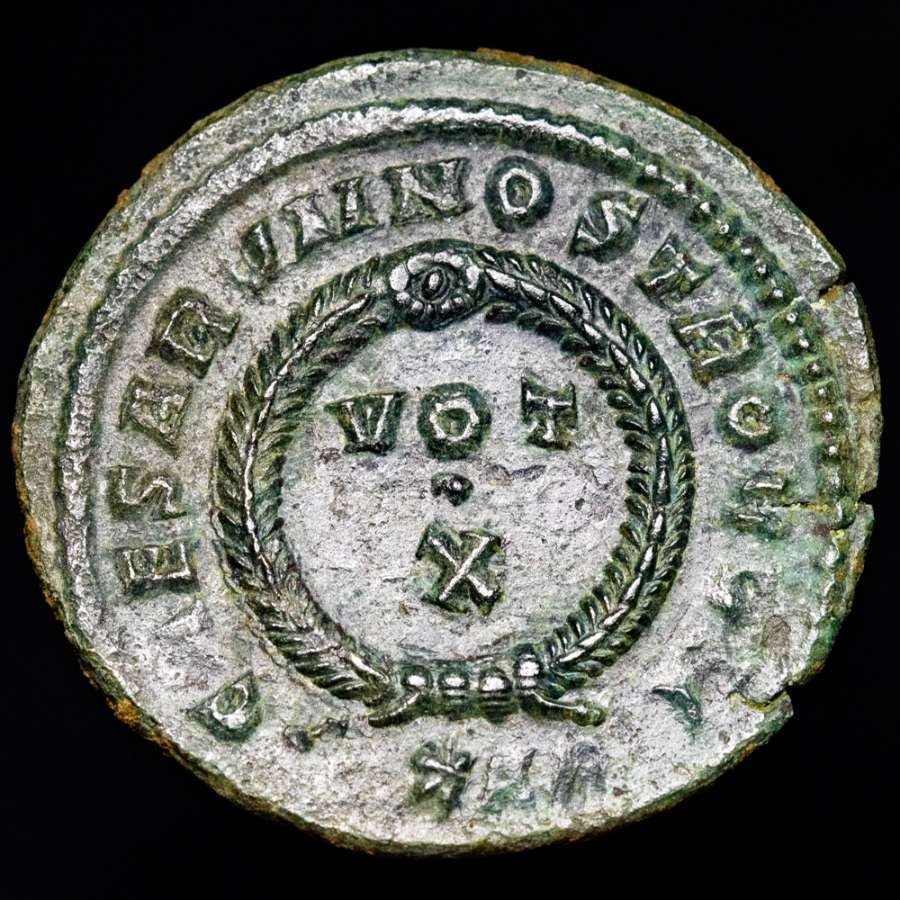 Roman Empire. Crispus (AD 317-326). Follis Arles mint, 316-326 A.D.. CAESARVM NOSTRORVM VOT / X in two lines within decorated wreath; S☆AR. (No reserve price) #1.0