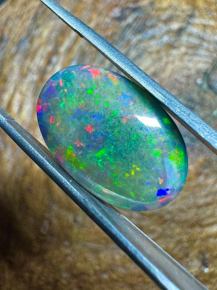 Qualità top! Opale nero d'Etiopia. 16,04 carati. Cabochon ovale - Altezza: 20.2 mm - Larghezza: 13.2 mm- 3.21 g #4.3