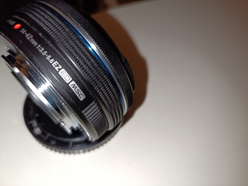 Olympus M.Zuiko Digital ED 14-42mm f3.5-5.6 EZ MSC Negro / MINT / Tapa automatica Objectif principal #3.2