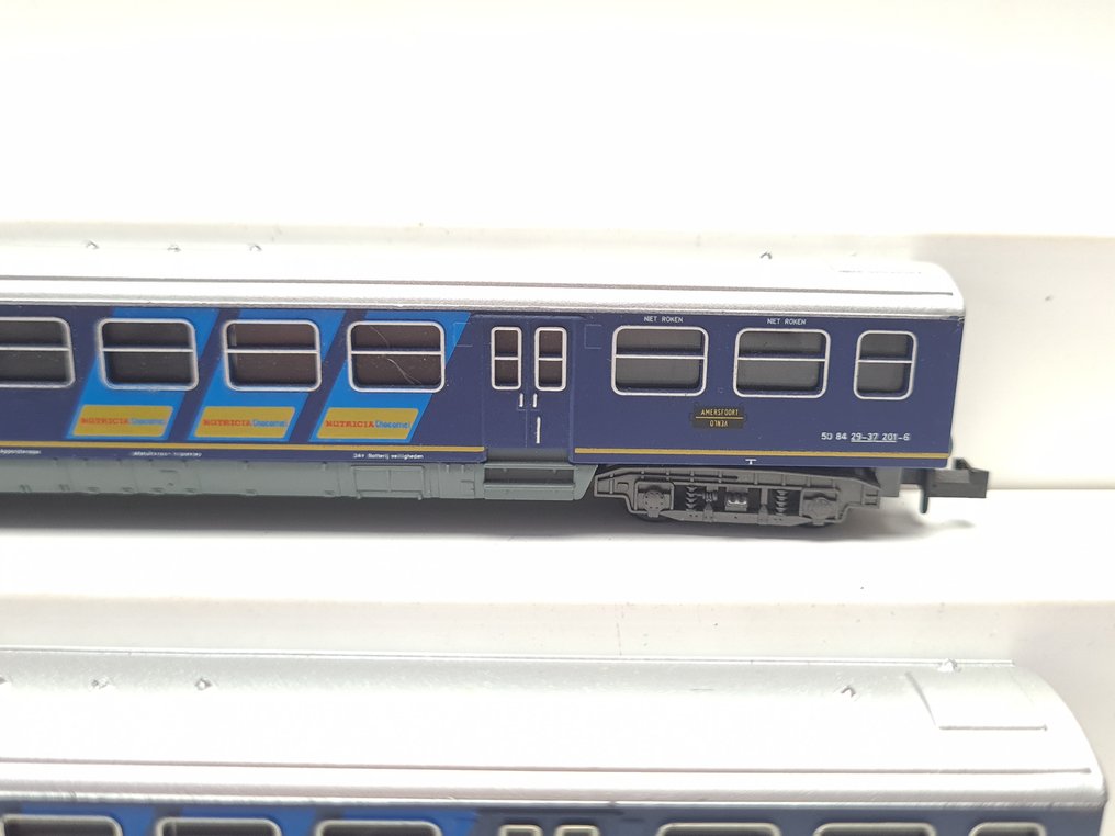 Minitrix N - 13120/13121 - Model train (4) - 4x Plan E carriages with advertising banners 'Nutricia Chocomel'. - NS #3.2