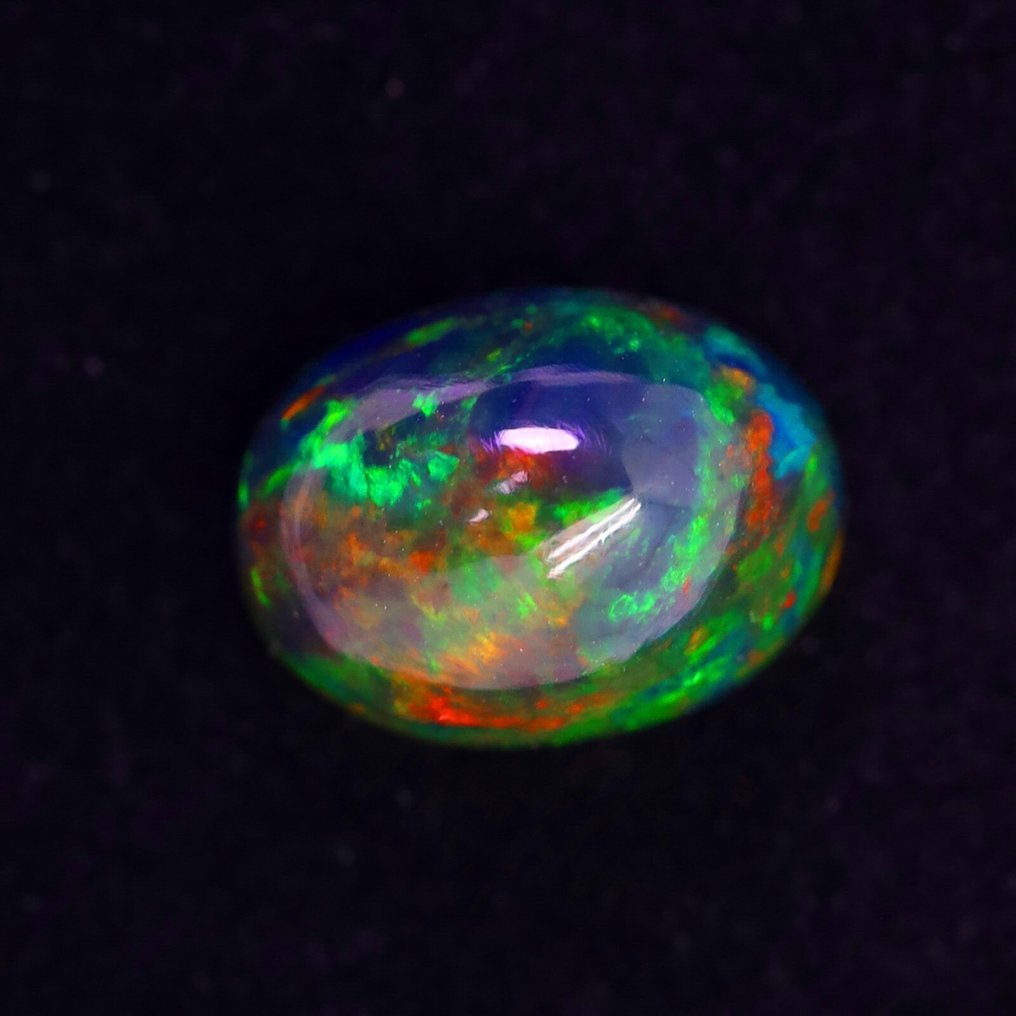 2.42 克拉最纯净的 Welo Opal(带烟熏效果)孔雀色,来自埃塞俄比亚,迷人的彩虹色彩变化 弧面形- 0.56 g #1.0