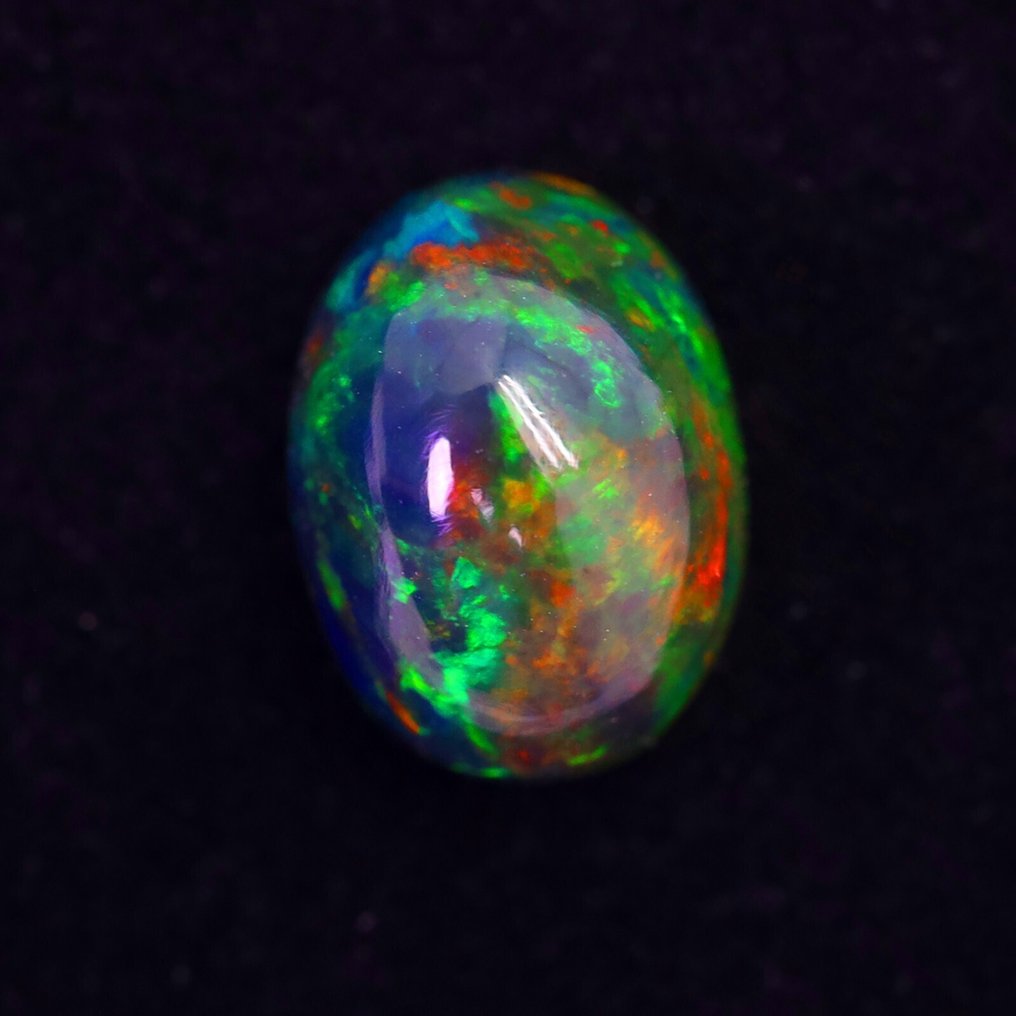 2.42 克拉最纯净的 Welo Opal(带烟熏效果)孔雀色,来自埃塞俄比亚,迷人的彩虹色彩变化 弧面形- 0.56 g #3.2