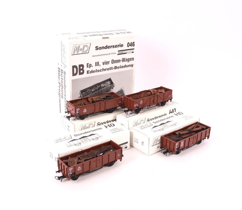 M+D Modell H0 - 046 - 模型貨運火車組合 (1) - 四辆敞篷货车装载着废金属。 - DB #1.0