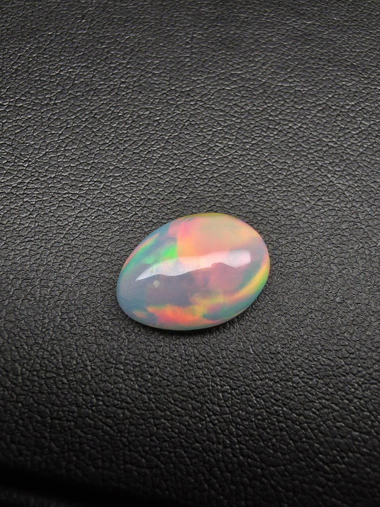 3,4 ct vita opal Cabochon - Höjd: 14.6 mm - Bredd: 10.9 mm- 0.68 g #2.1