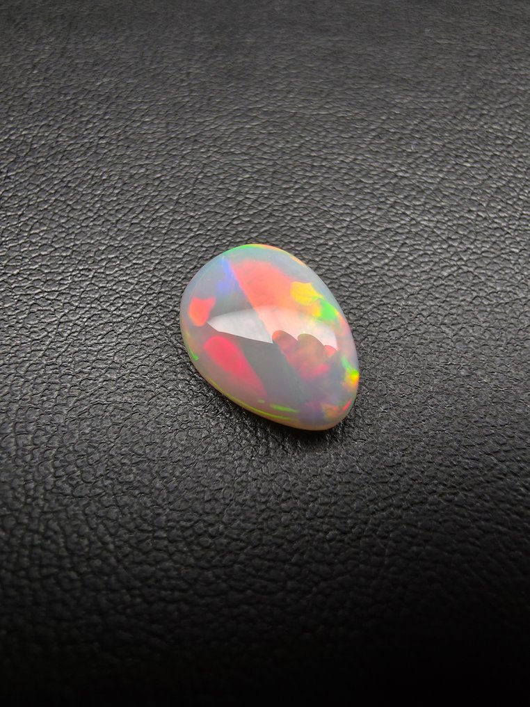Opal natural alb de 4ct Caboșon - Înălțime: 13.1 mm - Lățime: 9.6 mm- 0.8 g #1.0