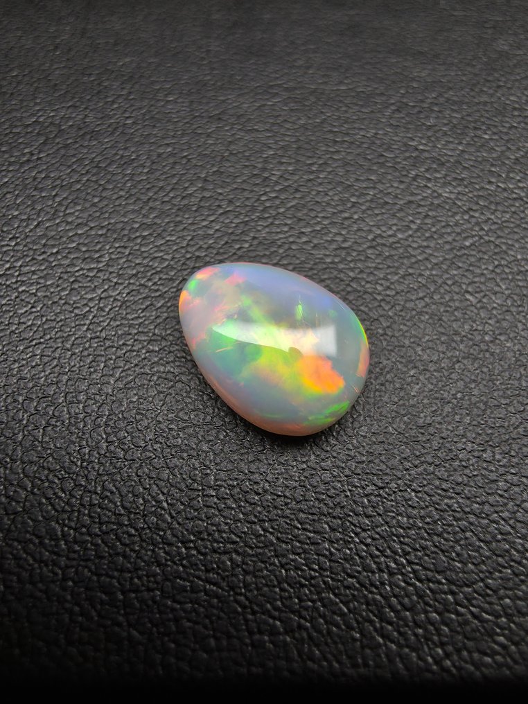 Opal natural alb de 4ct Caboșon - Înălțime: 13.1 mm - Lățime: 9.6 mm- 0.8 g #3.2