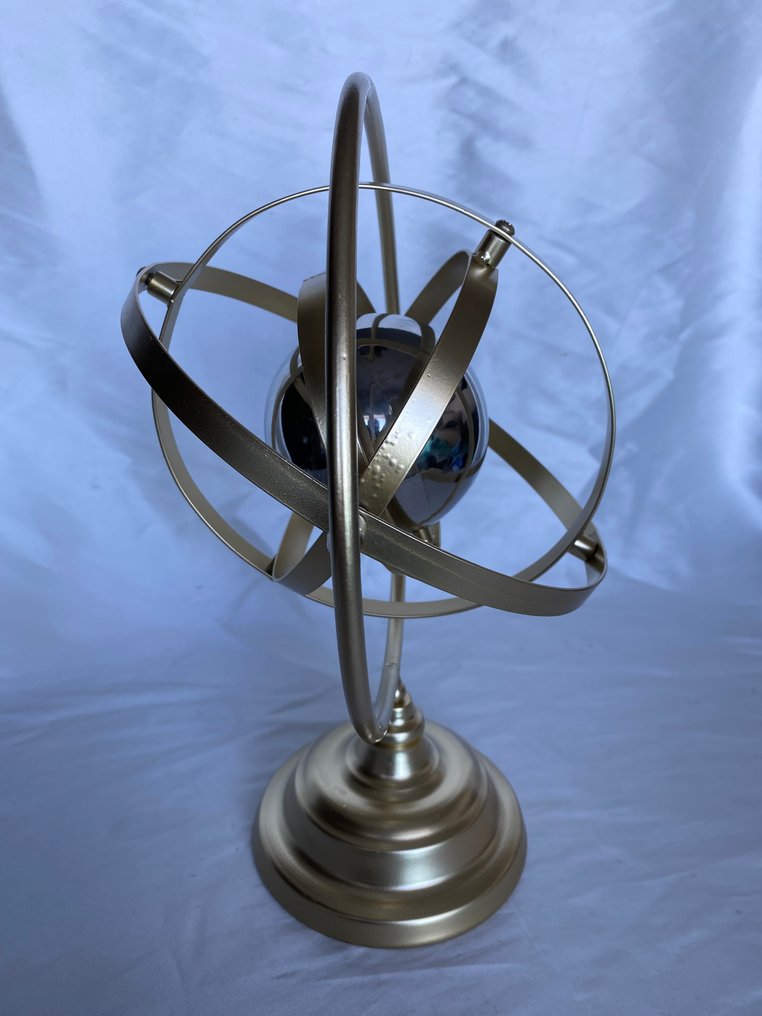 Made of iron structure, all its rings and the central globe rotate. - 1990 #2.1