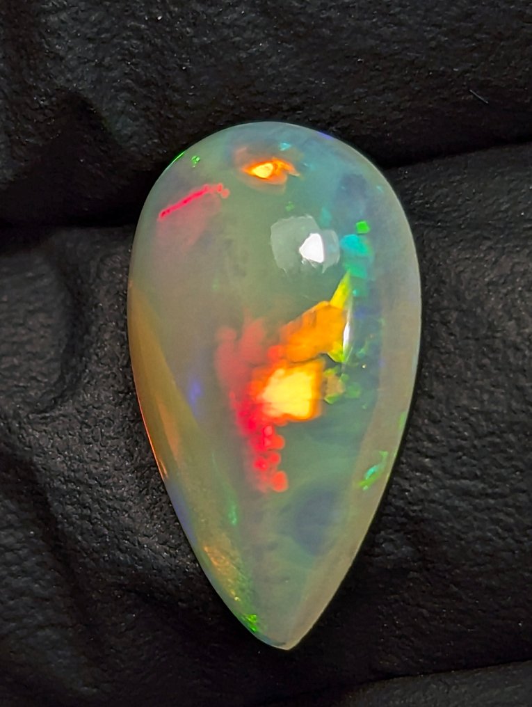 2,65 ct - Όμορφος φυσικός πολύτιμος λίθος Welo Opal, με έντονο παιχνίδι χρωμάτων. Καμπουσόν - Ύψος: 15 mm - Πλάτος: 9 mm- 0.53 g - (1) #4.3