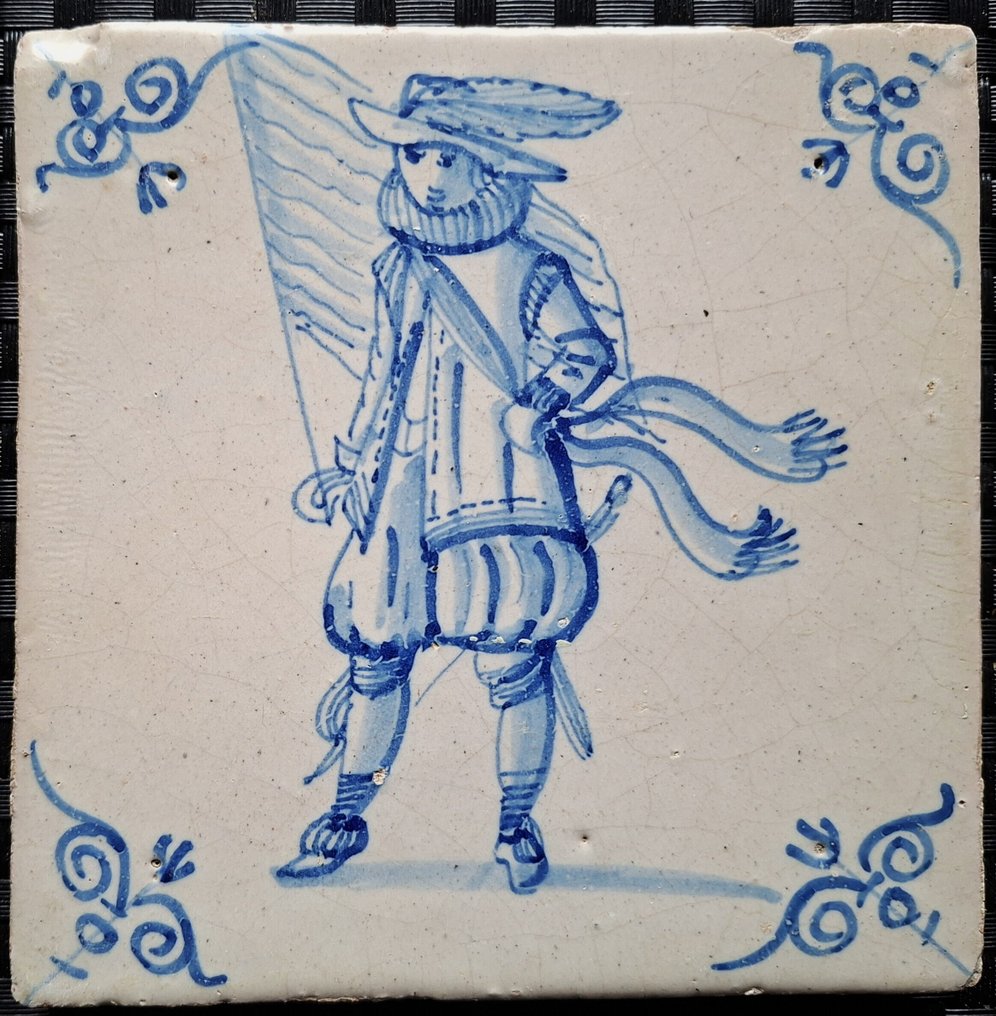  Tile - Antique Delft blue tile with a flag bearer. - 1600-1650  #3.2