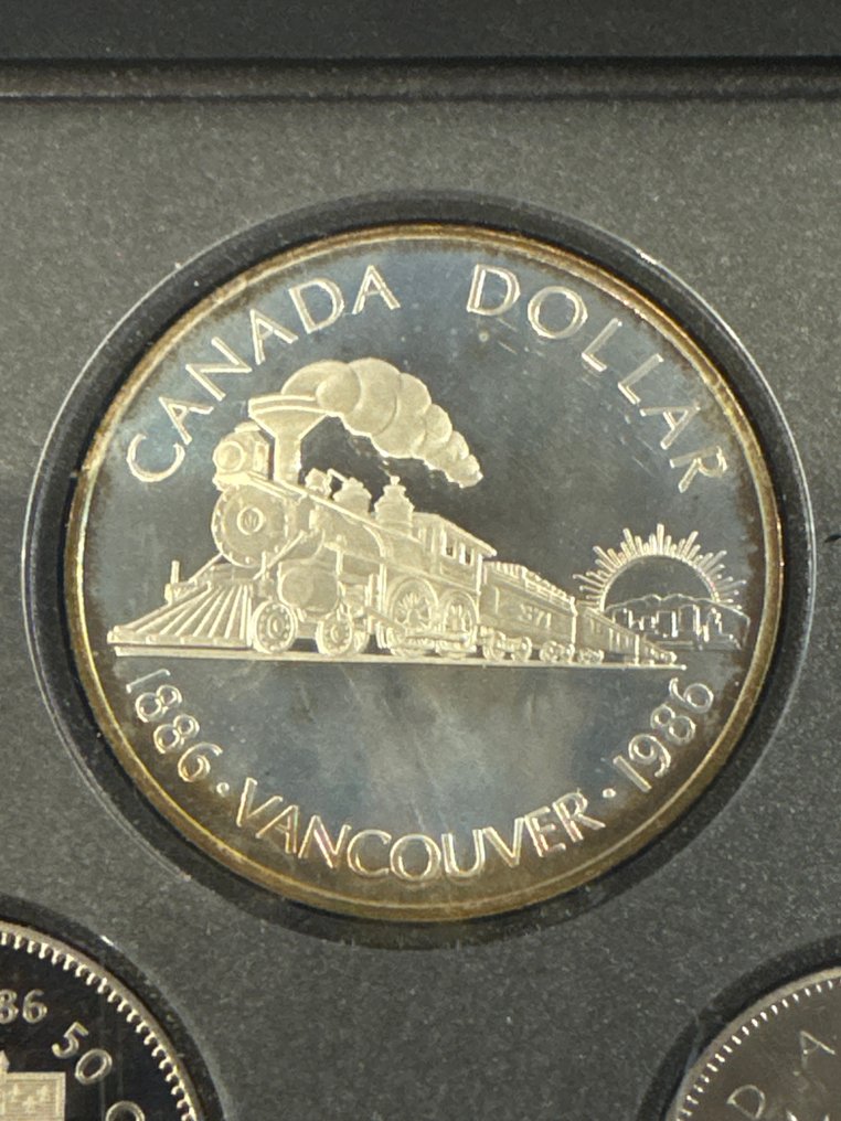 Canada. 1 Dollar 1986 KMS mit Vancouver, Proof 23.32g mit CoA und BOX  (No reserve price) #1.0