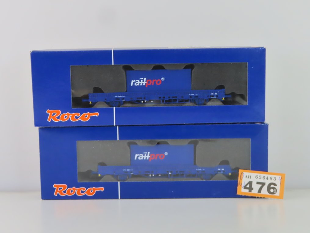 Roco H0 - 66678 - Carrozza merci di modellini di treni (2) - 2 camion a cassone aperto basso a 2 assi con carico (container) - NS #2.1