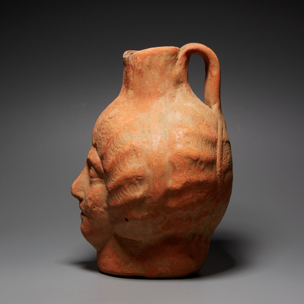 Ancient Roman Terracotta Pitcher in the shape of a human head. 1st-3rd century AD. 17.5 cm height. #4.3