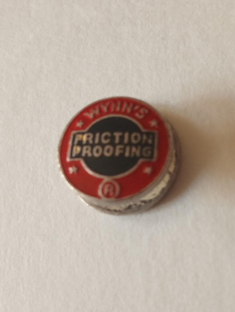 Pin badge WYNN'S FRICTION PROOFING - USA - 20th - mid (WW II) #1.0