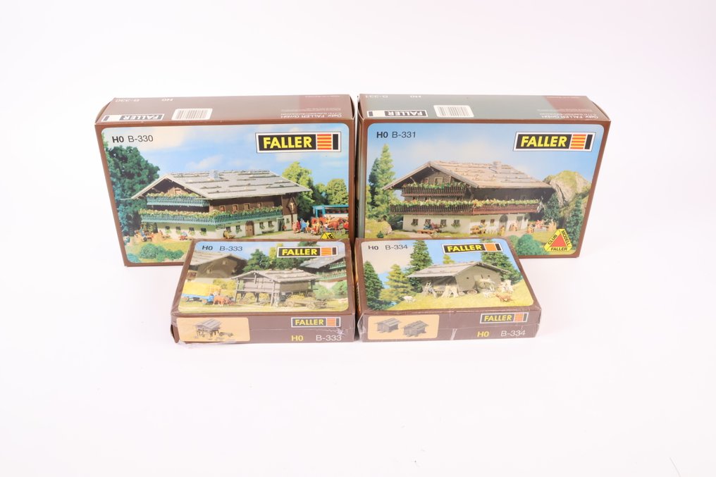 Faller H0 - 330/331/333/334 - Model train building kits (4) - Four building kits: Alpine farms and hay barns. #1.0