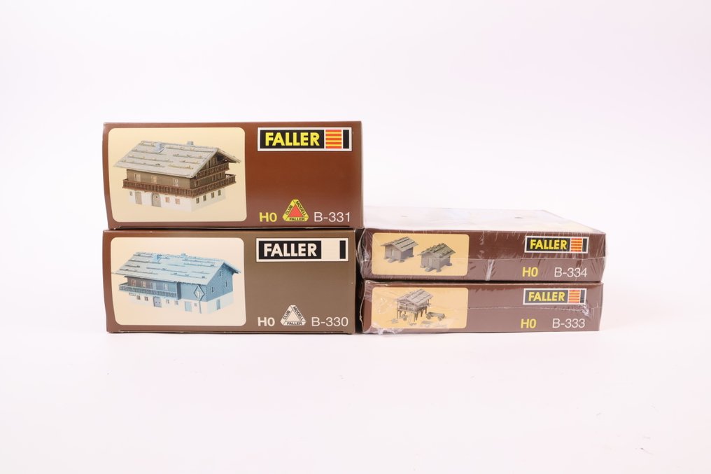 Faller H0 - 330/331/333/334 - Model train building kits (4) - Four building kits: Alpine farms and hay barns. #1.0
