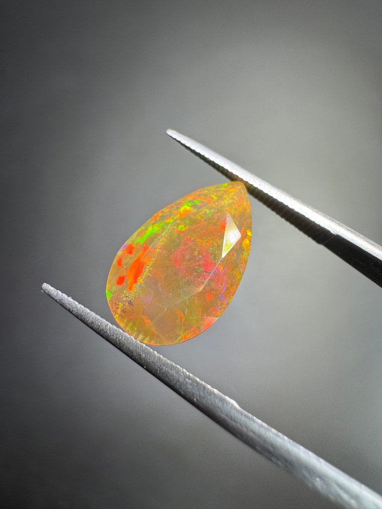 Πορτοκαλί οπάλ με φάτσα από την Αιθιοπία. 1,87 καράτια. Χωρίς όριο τιμής. Αχλάδι με πολλαπλές όψεις - Ύψος: 12.7 mm - Πλάτος: 7.7 mm- 0.37 g #1.0