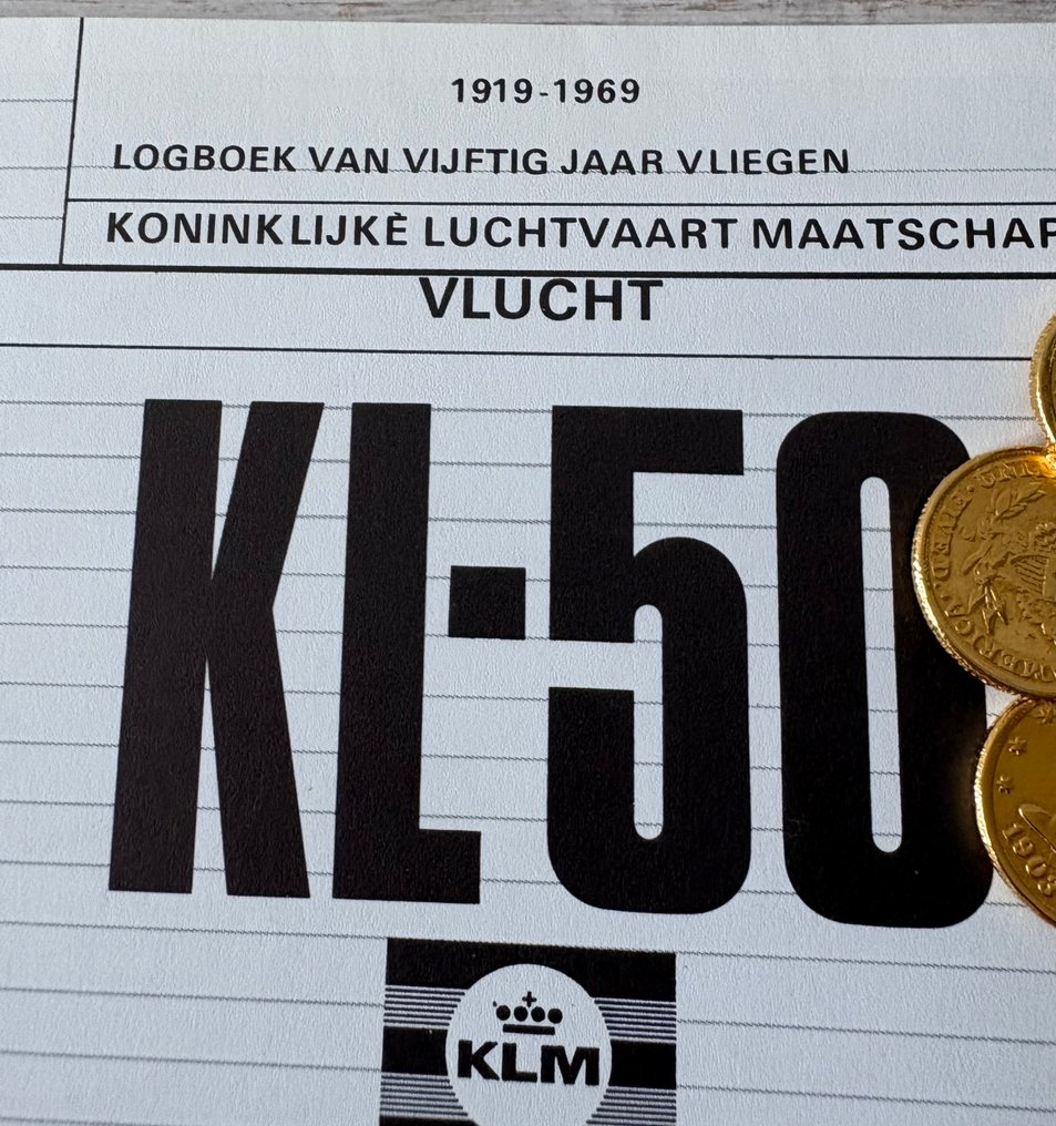 KLM Commemorative coin (American Airlines by Lucien Piccard) and internal KLM book. - 1960-1970 - 50 years of KLM #2.1