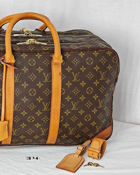 Sold at Auction: Louis Vuitton, LOUIS VUITTON ALIZE TRAVEL BAG