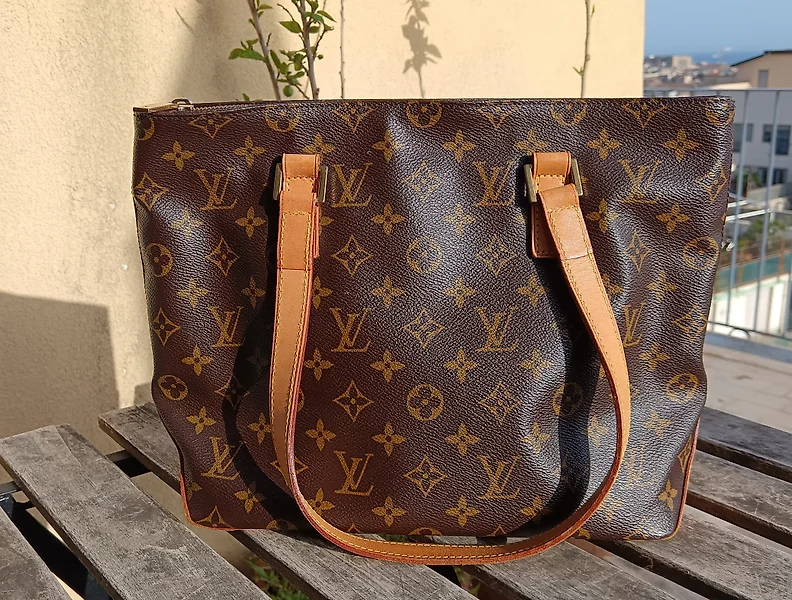 Refinished the leather on my vintage Louis Vuitton Alma bag and hand  painted it with a red-pink that I am in LOVE with. Covered all the stains  and scuffs and looks brand