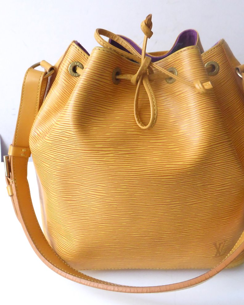 Sold at Auction: Louis Vuitton, Louis Vuitton Tassil Yellow Epi Leather  Petit Noe