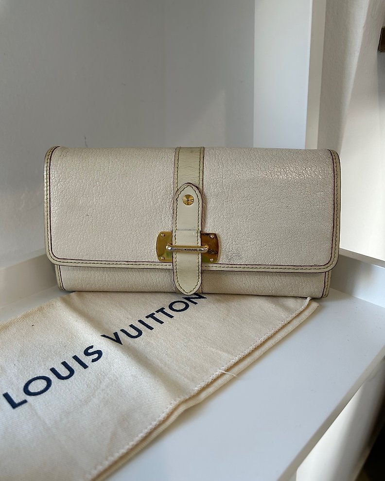 Louis Vuitton portafoglio Capucines in pelle grigio chiaro
