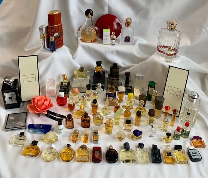 Vintage perfume bottles including Chanel, Jicky, Nina Ricci and