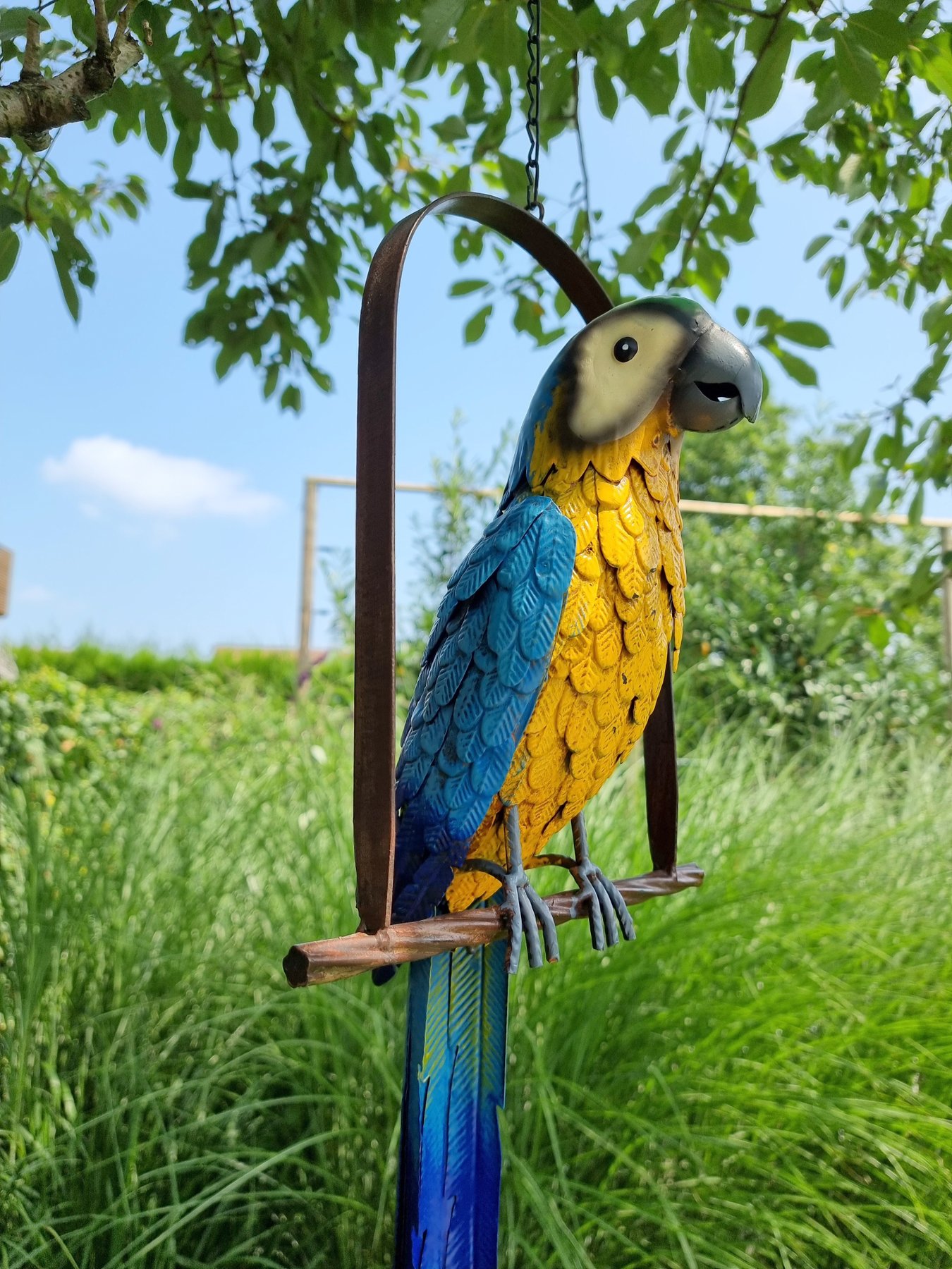 Parrot on swing metal Catawiki