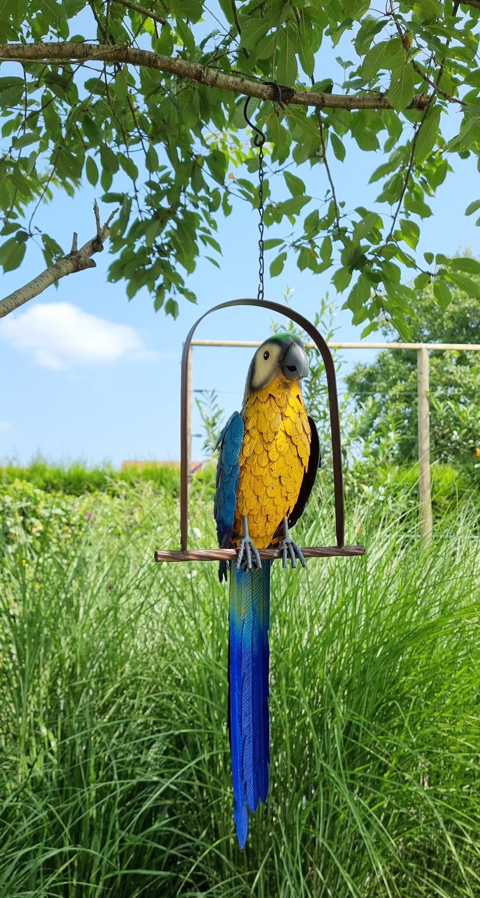 Parrot on swing metal Catawiki
