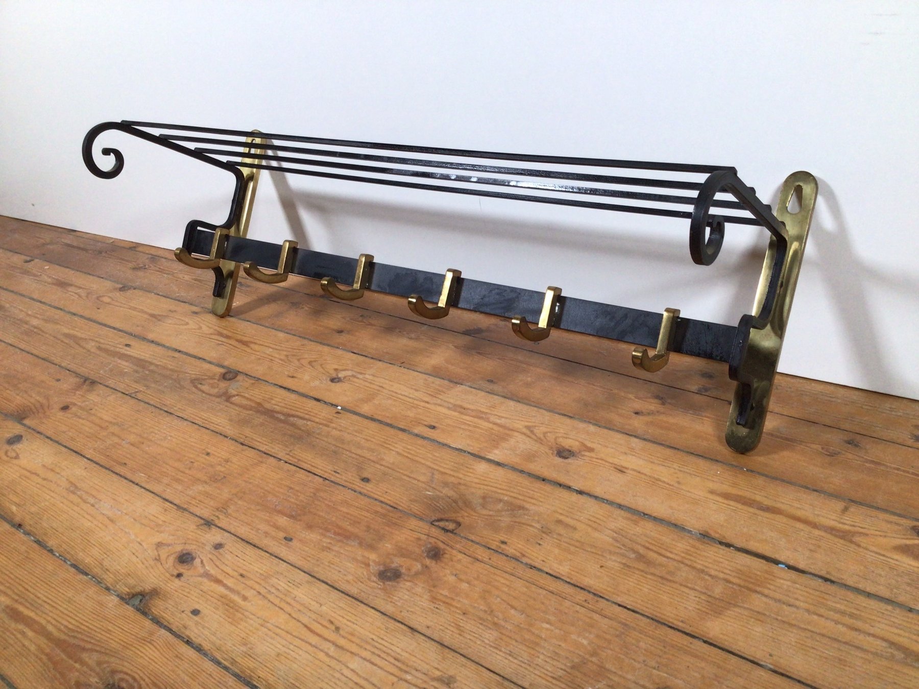A heavy coat rack made of metal and brass Catawiki